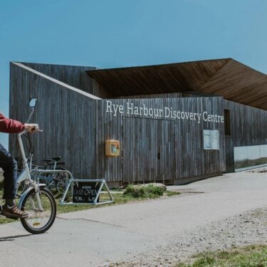 Rye Harbour Discovery Centre with cyclist