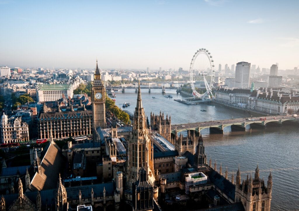 Aerial view of Houses of Parliament, River Thames and London Eye big wheel 