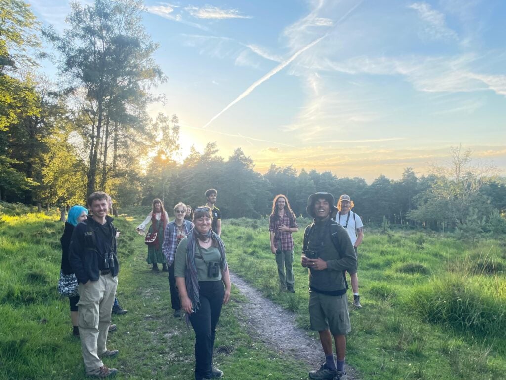 Group of young people on heathland on a summer's evening