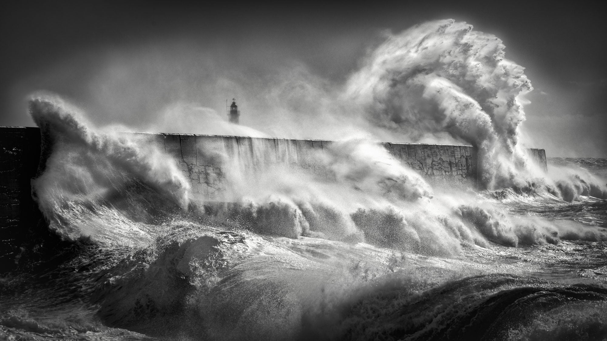 Storm waves hitting a breakwater
